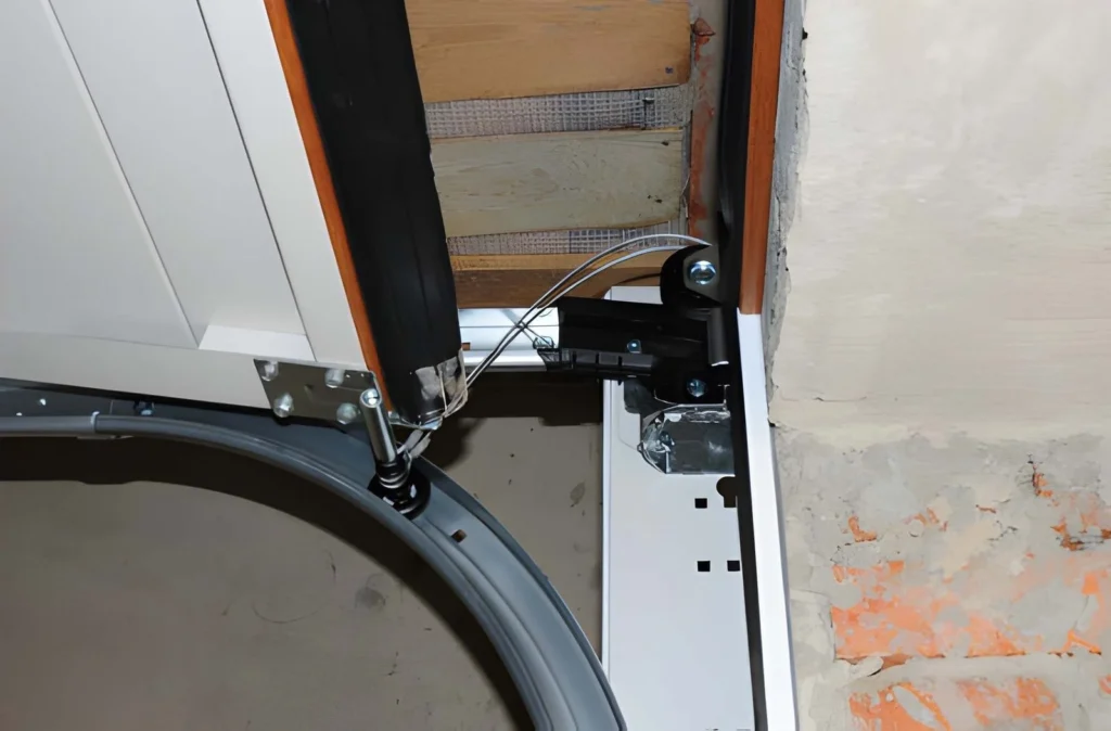 Close up of garage door spring and track system during professional repair